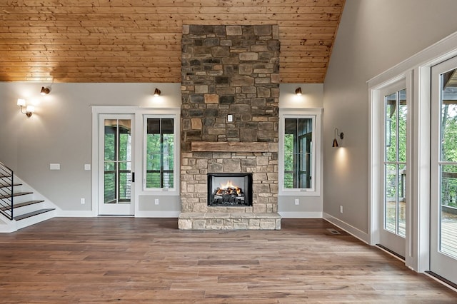 1036 Hidden River Rd, Rock Island, TN 38581 - unfurnished living room featuring wood ceiling, high vaulted ceiling, wood finished floors, stairs, and a fireplace