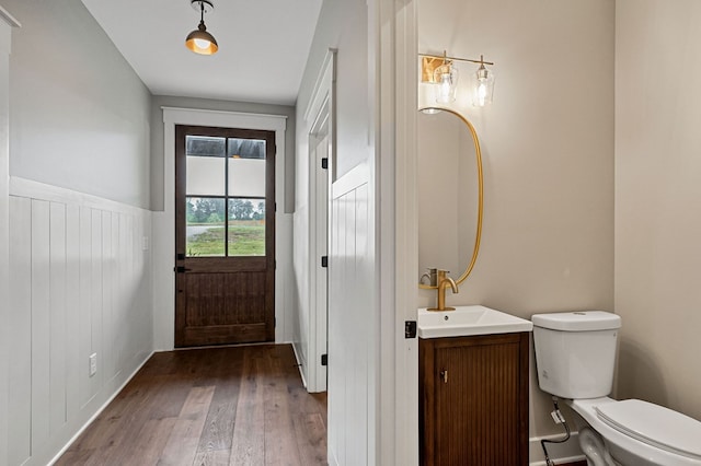 1036 Hidden River Rd, Rock Island, TN 38581 - half bathroom featuring wood finished floors, vanity, and a wainscoted wall