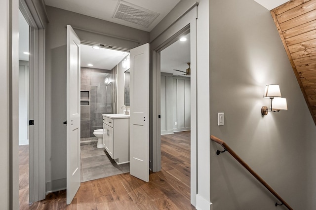 1036 Hidden River Rd, Rock Island, TN 38581 - hallway featuring wood finished floors and an upstairs landing
