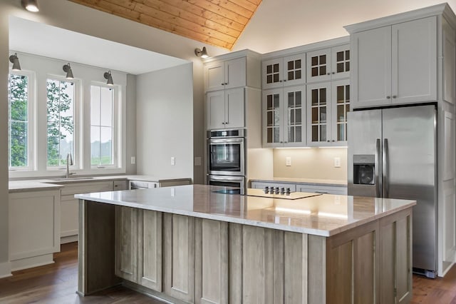 1036 Hidden River Rd, Rock Island, TN 38581 - kitchen with appliances with stainless steel finishes, lofted ceiling, dark wood-style flooring, wood ceiling, and a center island
