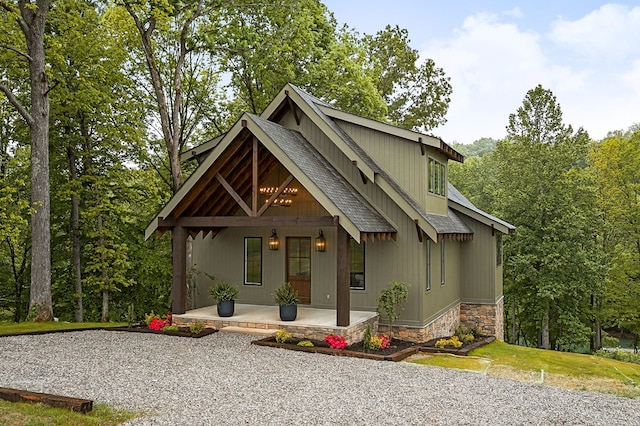 1036 Hidden River Rd, Rock Island, TN 38581 - chalet / cabin featuring covered porch, roof with shingles, and stone siding