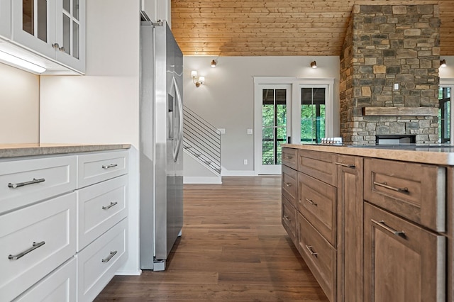1036 Hidden River Rd, Rock Island, TN 38581 - kitchen with stainless steel fridge, wood ceiling, dark wood finished floors, white cabinetry, and glass insert cabinets