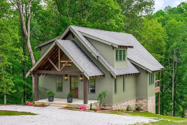 1036 Hidden River Rd, Rock Island, TN 38581 - view of front of property featuring covered porch, roof with shingles, and stone siding
