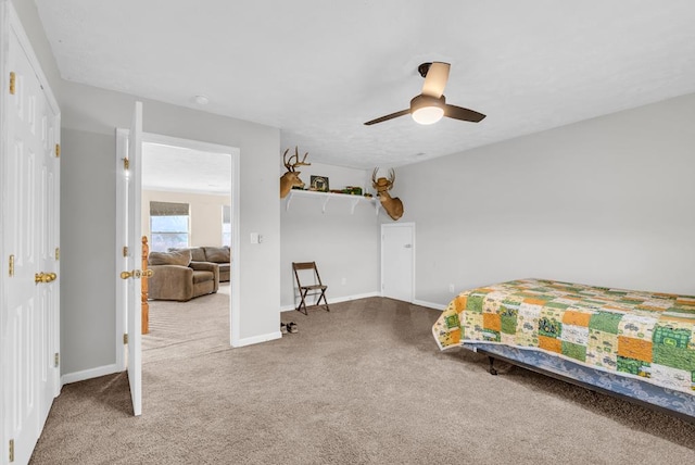 bedroom featuring carpet flooring, a ceiling fan, and baseboards