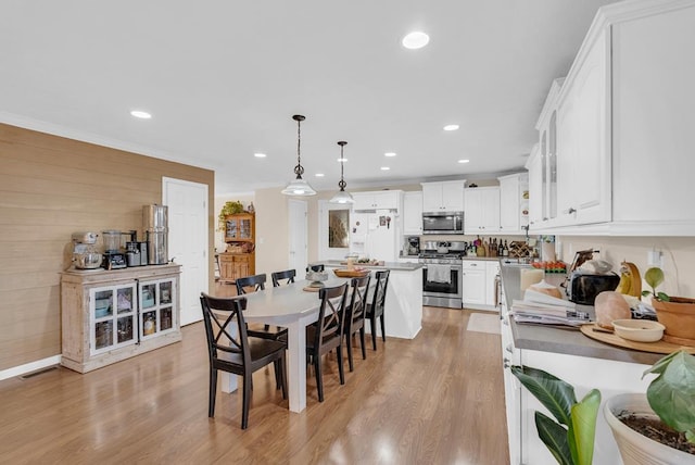 dining space with recessed lighting, visible vents, and light wood-style floors