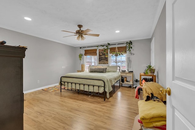 bedroom featuring ceiling fan, recessed lighting, baseboards, ornamental molding, and light wood-type flooring