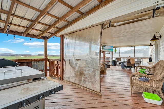 wooden deck with outdoor dining area