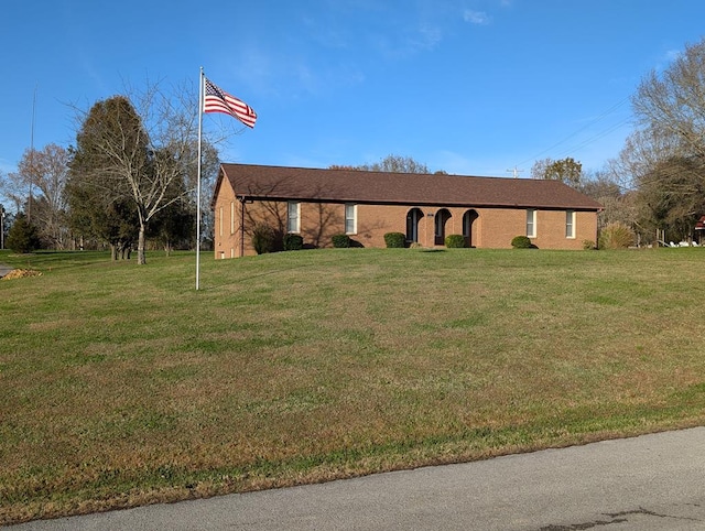 ranch-style house with a front lawn