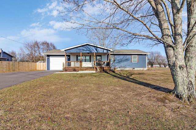 view of front facade with aphalt driveway, covered porch, fence, crawl space, and a front lawn