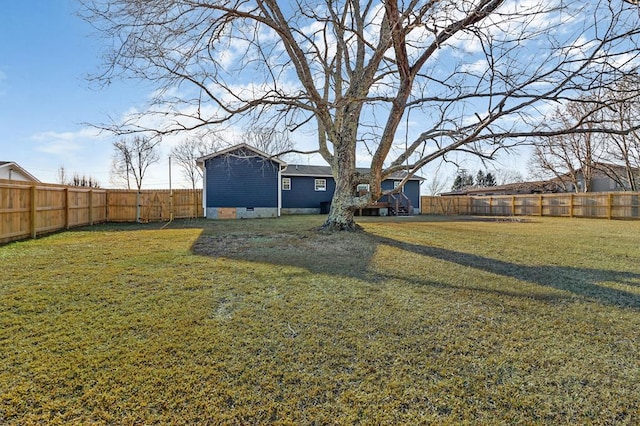 view of yard with a fenced backyard