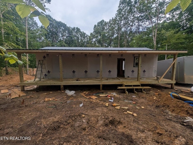 470 Trimmer Ln, Jamestown, TN 38556 - back of house featuring a metal roof, a deck, and view of wooded area