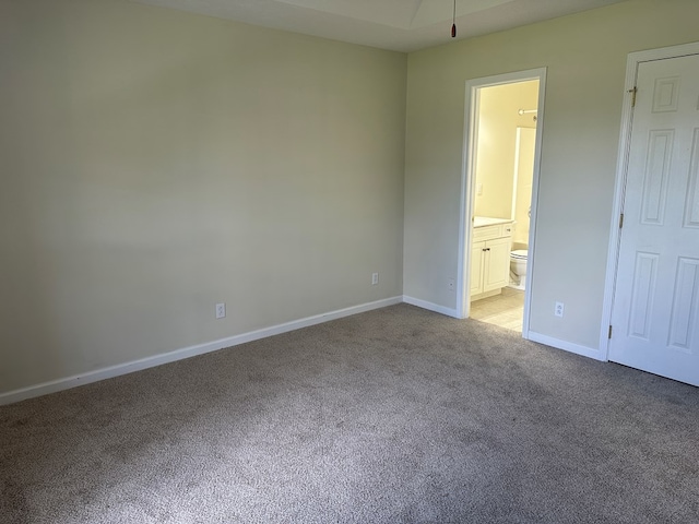 5514 Raven Xing, Baxter, TN 38544 - unfurnished bedroom with light colored carpet and connected bathroom
