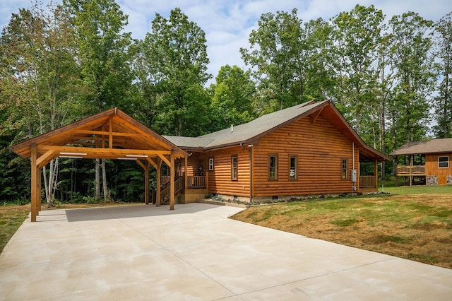 106 Raccoon Ln, Jamestown, TN 38556 - view of front of home with crawl space, driveway, a front yard, roof with shingles, and a carport