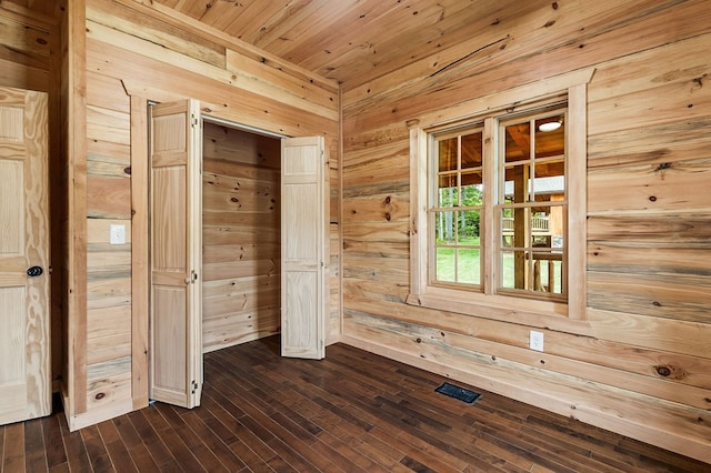 106 Raccoon Ln, Jamestown, TN 38556 - empty room featuring wooden walls, dark wood-style floors, and wood ceiling