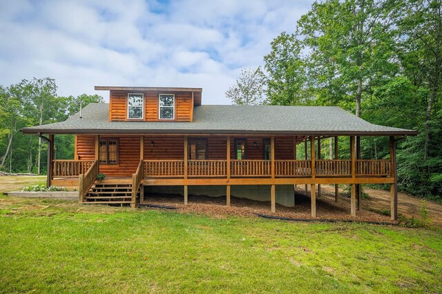 106 Raccoon Ln, Jamestown, TN 38556 - back of property with a lawn, roof with shingles, and a wooden deck