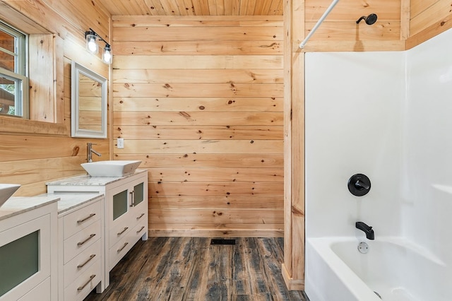 106 Raccoon Ln, Jamestown, TN 38556 - full bathroom featuring vanity, wood walls, wood finished floors, tub / shower combination, and wooden ceiling