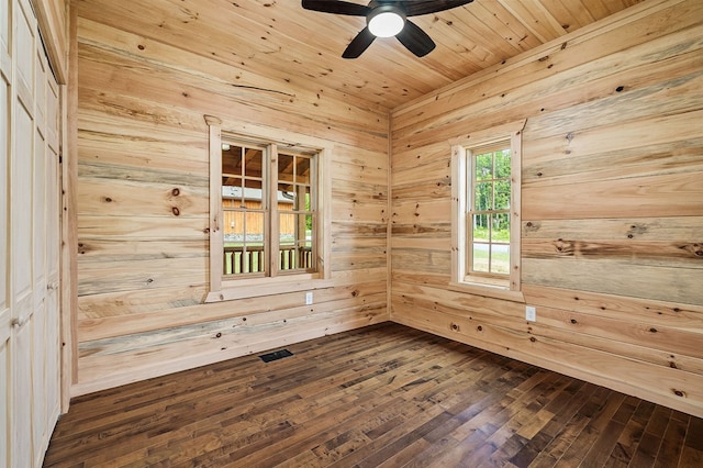 106 Raccoon Ln, Jamestown, TN 38556 - empty room with wood walls, ceiling fan, dark wood finished floors, and a sauna