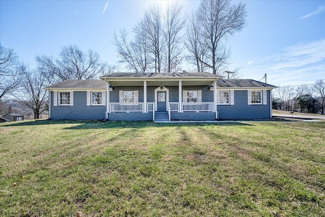 view of front facade featuring a porch, a front lawn, and brick siding