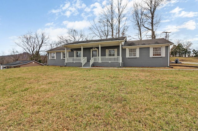 ranch-style house featuring a front lawn, a porch, and brick siding