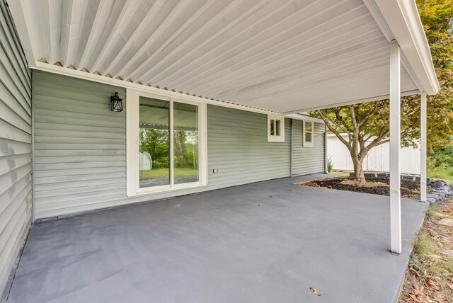 view of patio / terrace featuring a carport