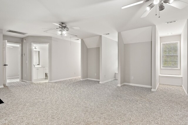 interior space featuring attic access, visible vents, and light colored carpet