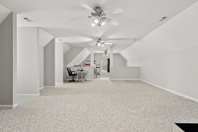 additional living space featuring vaulted ceiling, baseboards, visible vents, and light colored carpet