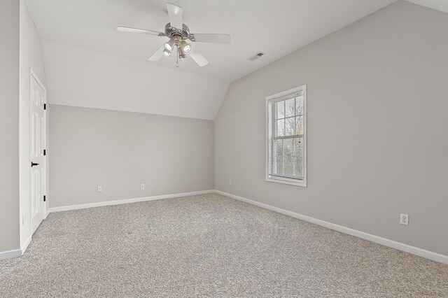 bonus room with baseboards, visible vents, lofted ceiling, ceiling fan, and carpet floors