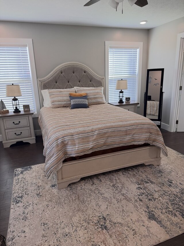 8501 Faix Rd, Byrdstown, TN 38549 - bedroom with dark wood finished floors, ceiling fan, and baseboards