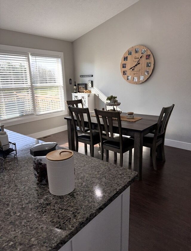 8501 Faix Rd, Byrdstown, TN 38549 - dining area featuring baseboards and dark wood finished floors