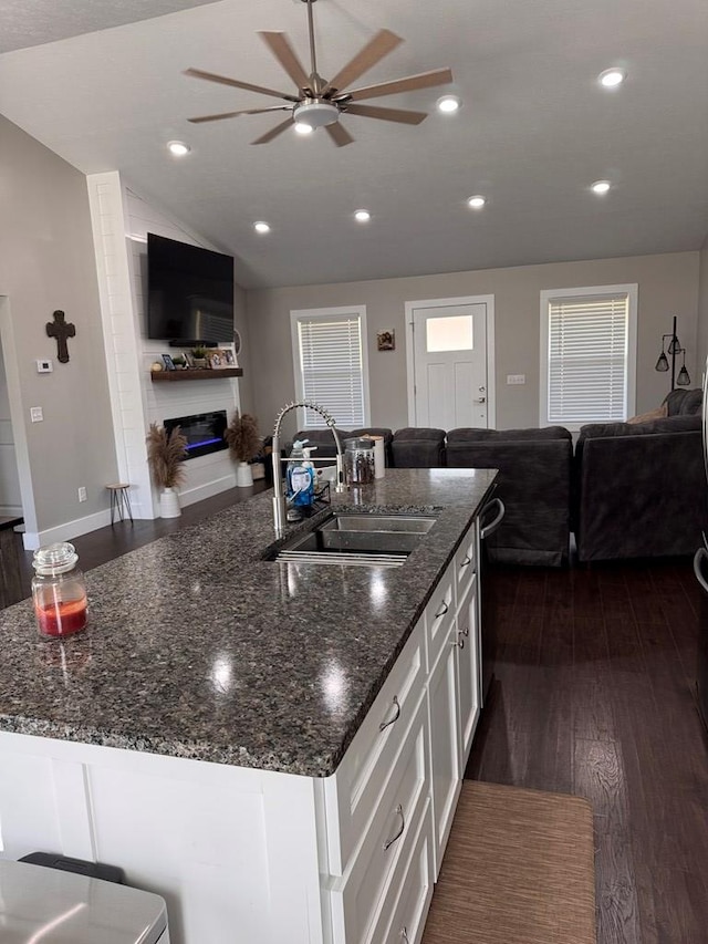 8501 Faix Rd, Byrdstown, TN 38549 - kitchen featuring a sink, open floor plan, ceiling fan, a glass covered fireplace, and vaulted ceiling