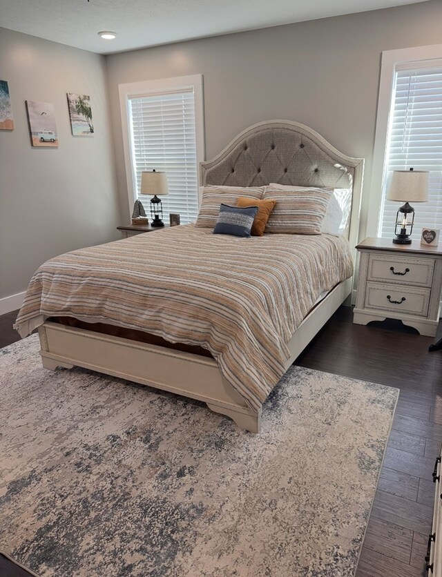 8501 Faix Rd, Byrdstown, TN 38549 - bedroom with dark wood-style floors, multiple windows, baseboards, and recessed lighting