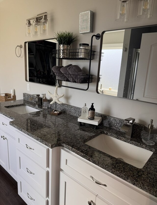 8501 Faix Rd, Byrdstown, TN 38549 - kitchen with a sink, white cabinets, dark stone countertops, and dark wood-style floors