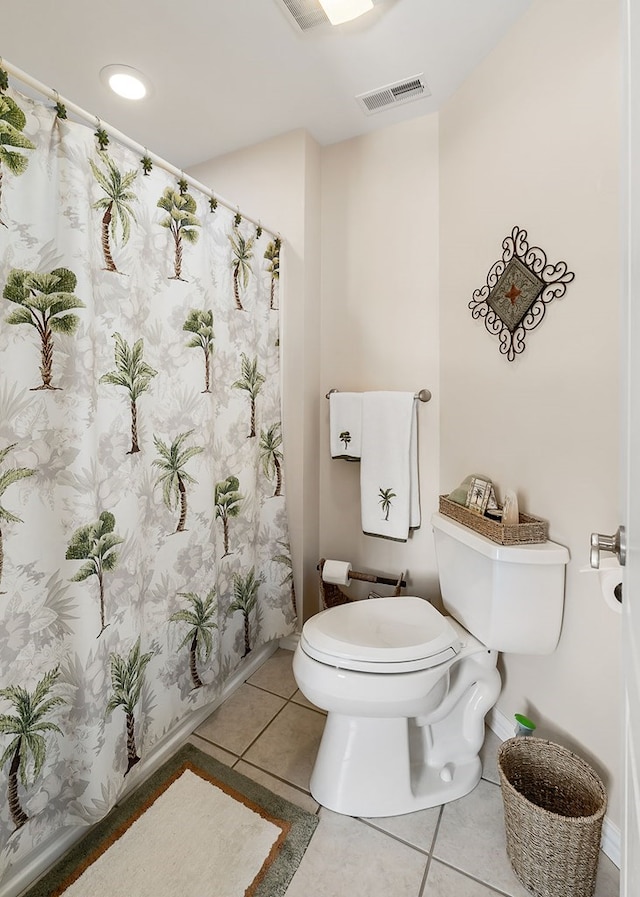 bathroom featuring visible vents, toilet, and tile patterned floors