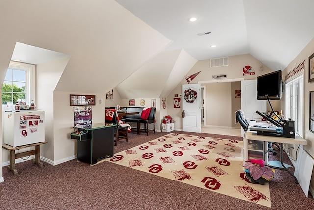 recreation room with vaulted ceiling, carpet floors, visible vents, and baseboards