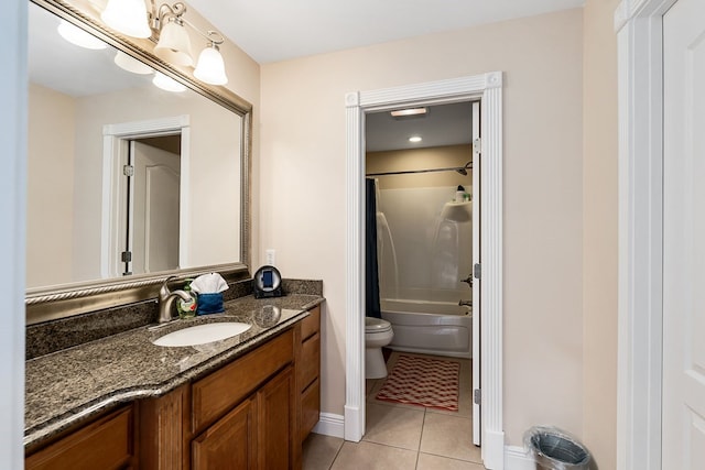 full bathroom with tile patterned flooring, toilet, shower / bath combination, vanity, and baseboards