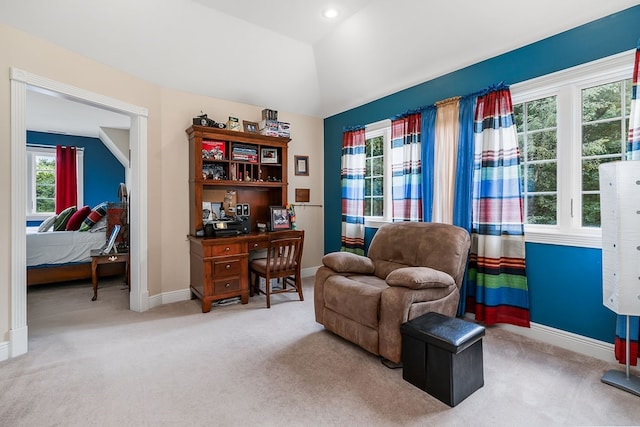 sitting room with baseboards, vaulted ceiling, and carpet flooring