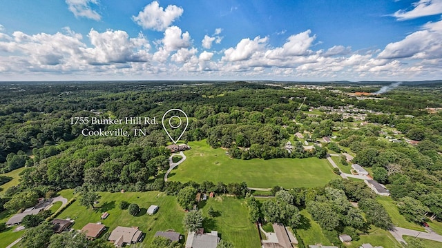 drone / aerial view featuring a forest view