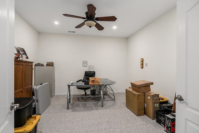 office space with visible vents, baseboards, light colored carpet, ceiling fan, and recessed lighting