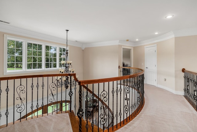 hall with crown molding, visible vents, an inviting chandelier, an upstairs landing, and baseboards