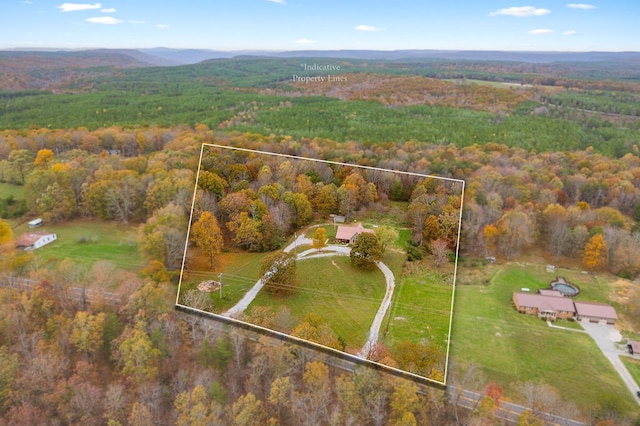 bird's eye view featuring a forest view