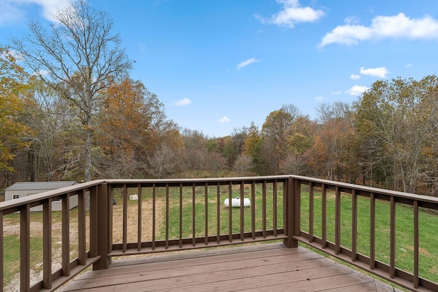 wooden deck with a yard