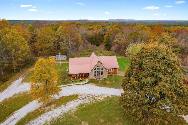 birds eye view of property with a forest view