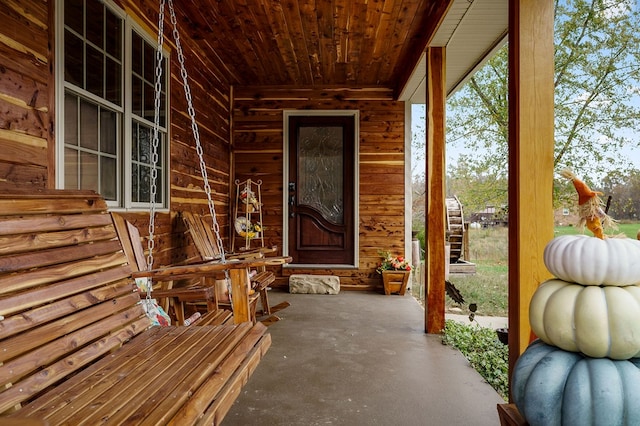 doorway to property featuring a porch