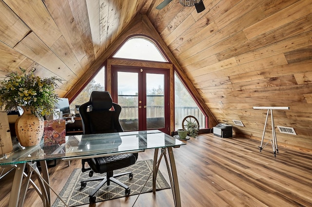 office with french doors, lofted ceiling, wood walls, wood finished floors, and wooden ceiling