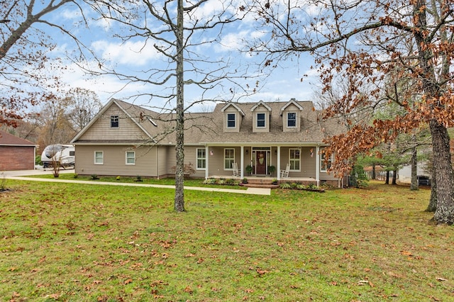 cape cod-style house featuring covered porch and a front yard