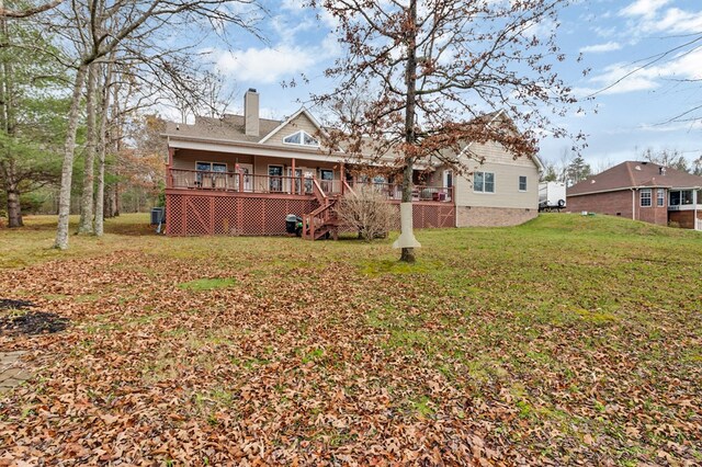 rear view of house featuring crawl space, a chimney, and a lawn