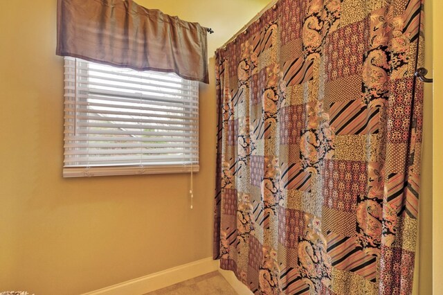 bathroom with baseboards