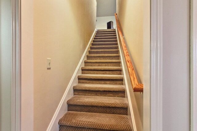 stairway with baseboards