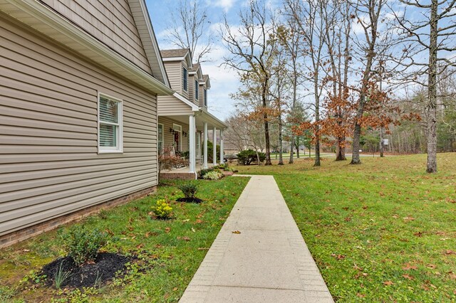 view of yard with covered porch