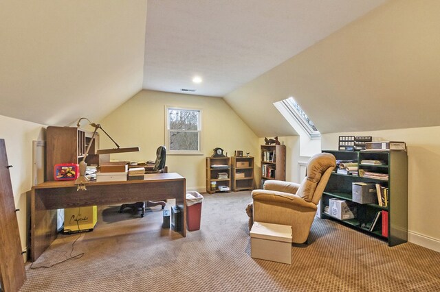 office area with lofted ceiling, carpet floors, visible vents, and baseboards